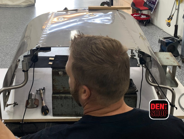 tim working on a car at dent shop