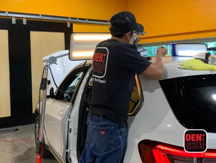 dent shop technician working